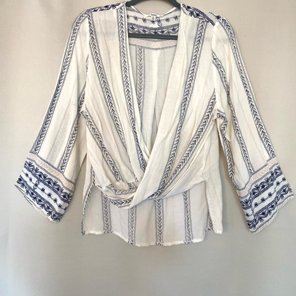 This beautiful blouse is light weight with a flattering cut on every body type.